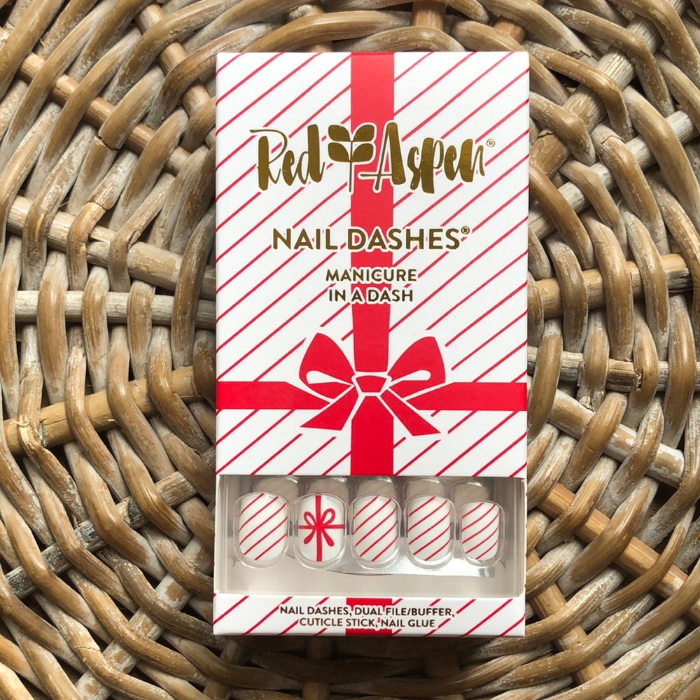 Festive holiday red and white press on nails by Red Aspen - Sandra’s Silk Bow